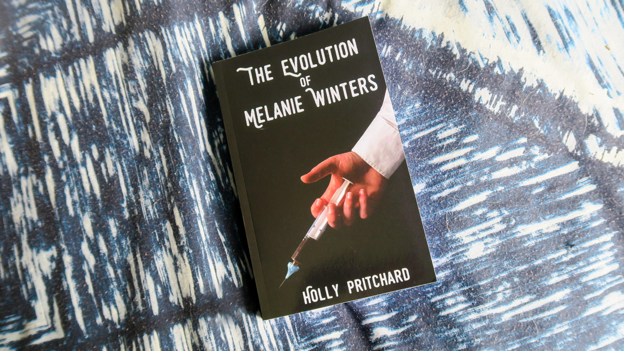 The Evolution of Melanie Winters on blue background
